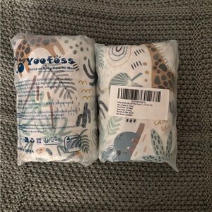 New in package. 2 sets of two crib sheets. Crib sheet pair.